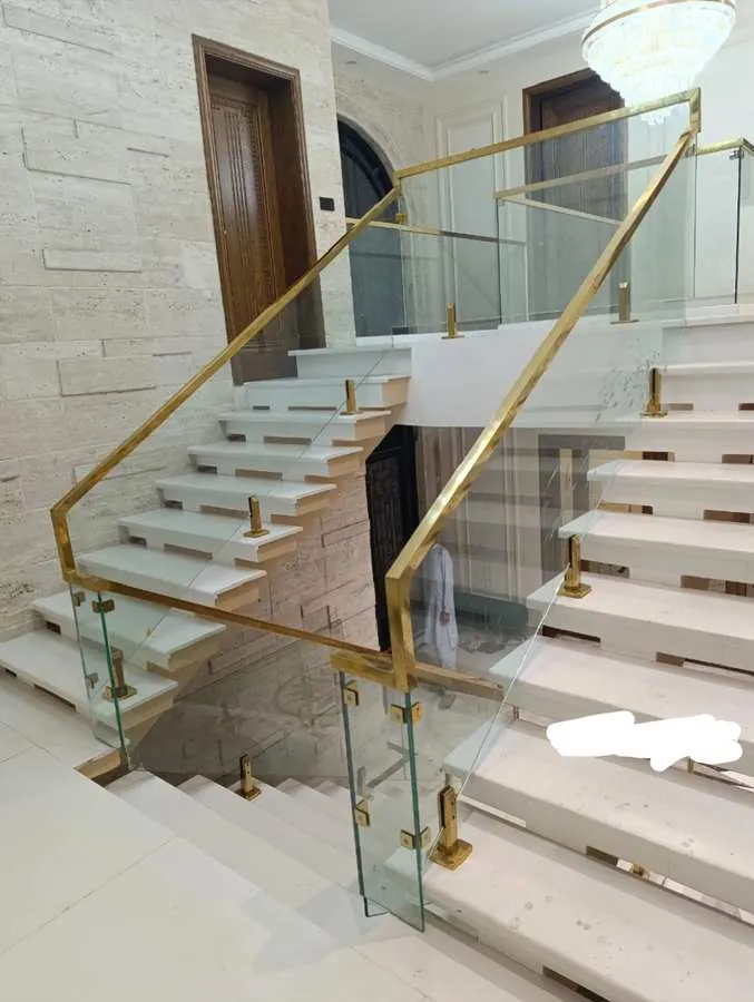 Gold fitting glass railing grand staircase