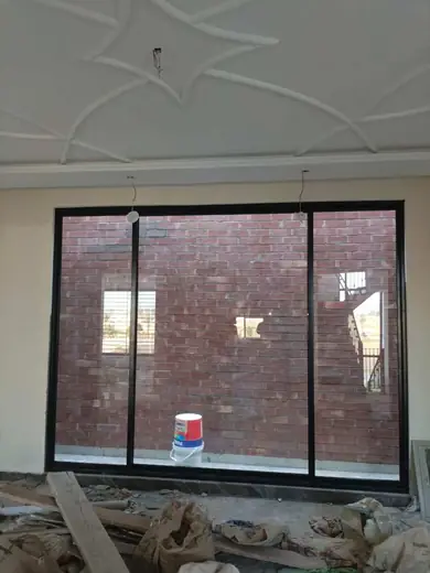 Large black frame aluminium window residential
