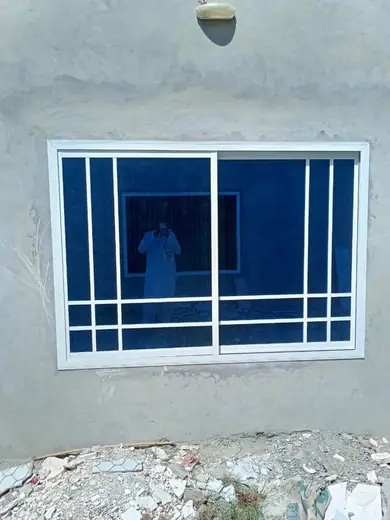 White frame blue glass window