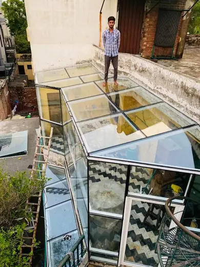 Glass skylight roof installation aerial view