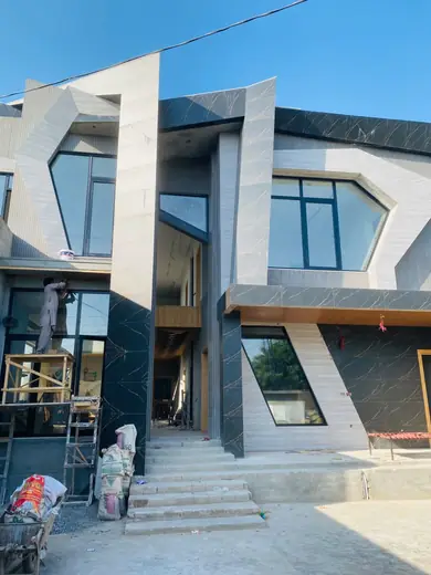 Modern home facade during window installation