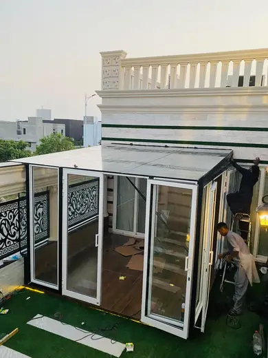 Terrace glass room installation with white aluminium frames
