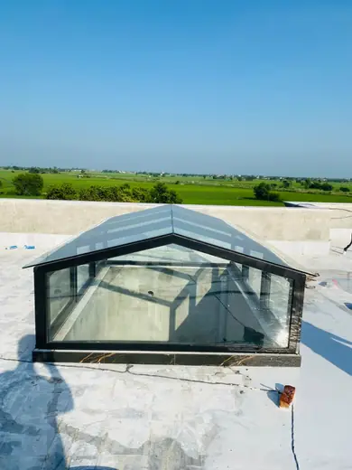 Glass skylight with gable roof on a rooftop