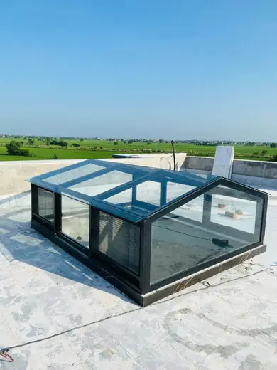 Black frame glass skylight on a rooftop